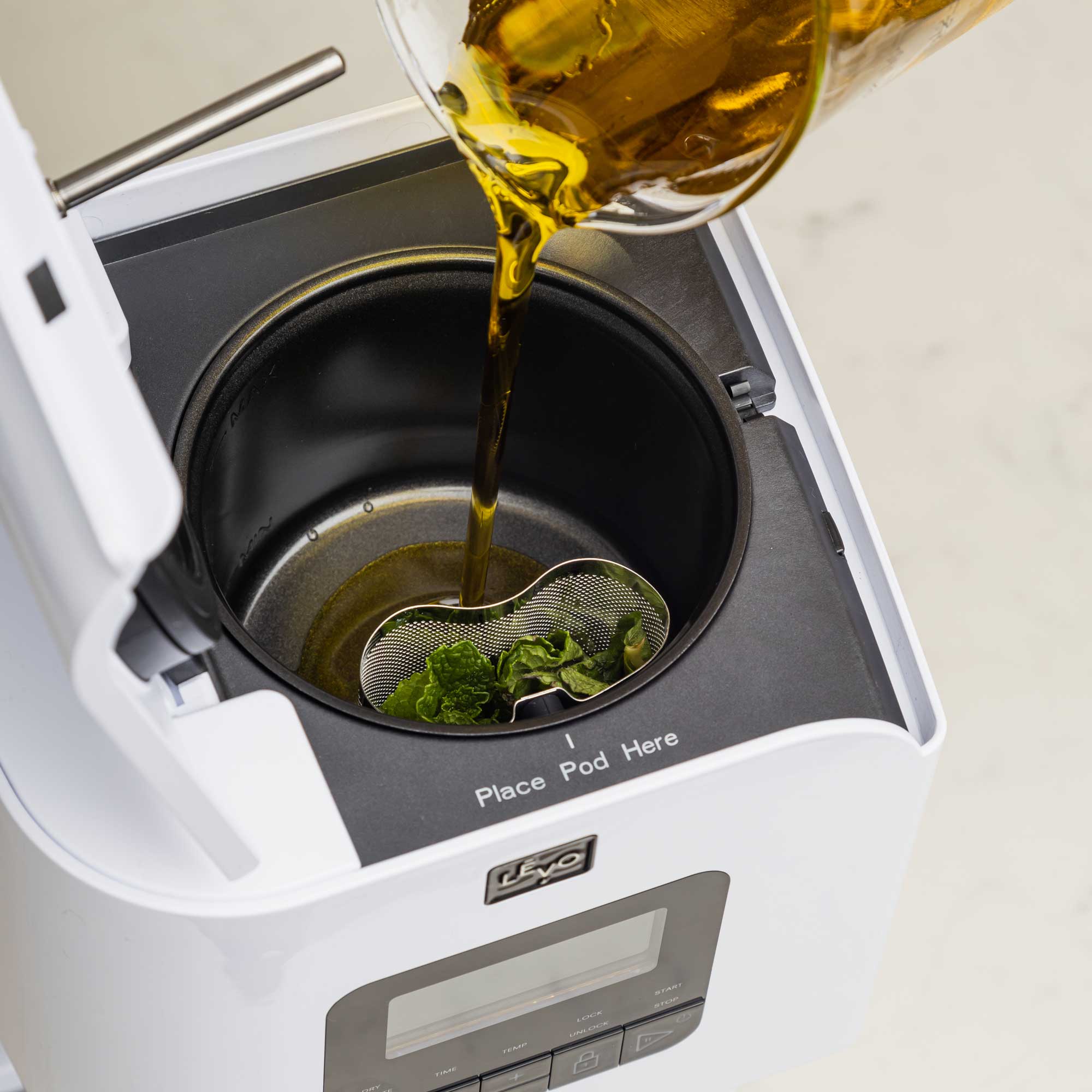 To use LEVO II, simple add your herbs, spices, fruits, or flower to the herb pod, and add oil, butter, milk, honey, simple syrup, glycerine, or even beeswax to the reservoir, close the lid, and infuse.