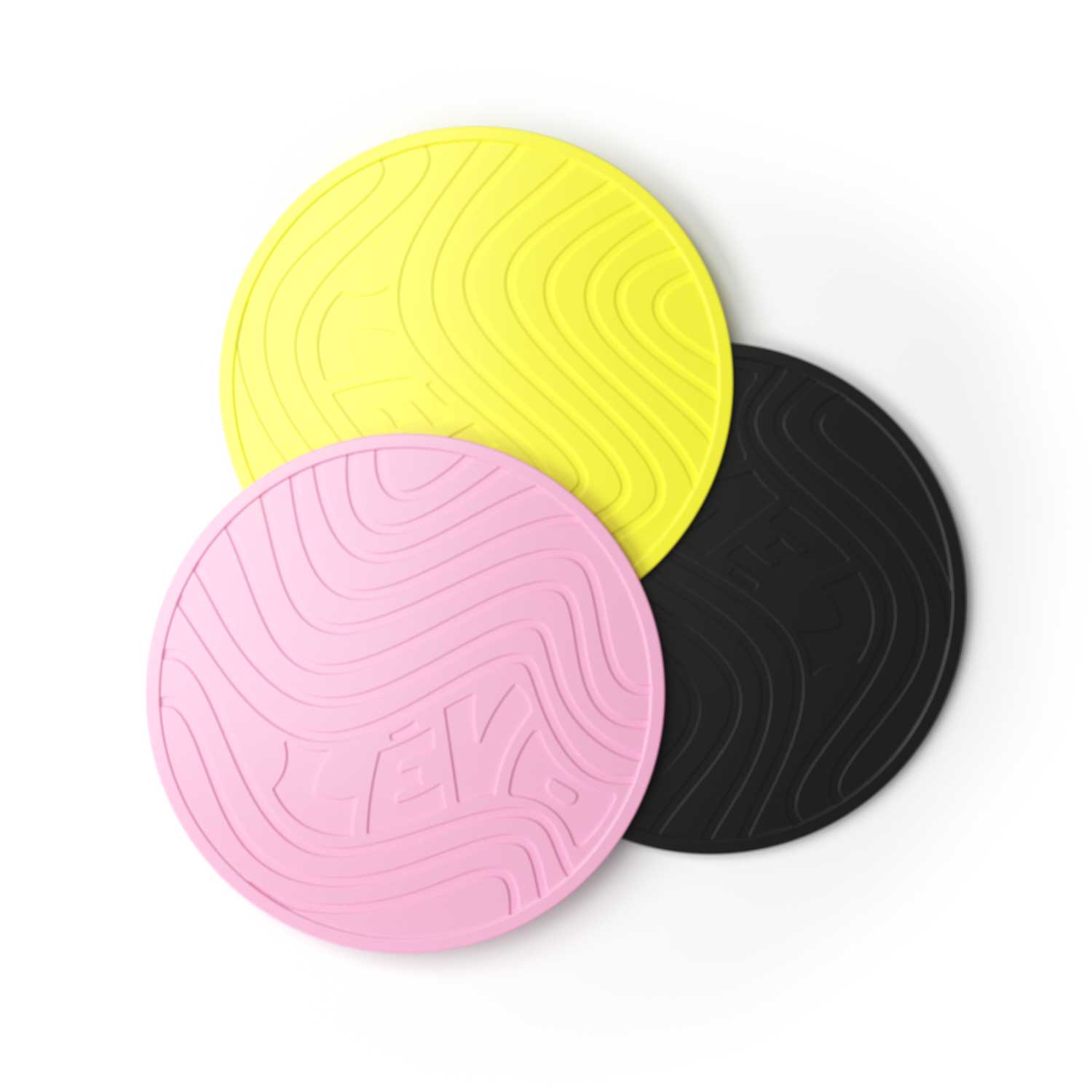 LĒVO Silicone Trivets in yellow, pink, and black